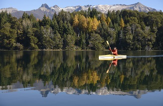 Kayaker in front of mountains