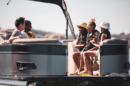 a crew of kids on a boat