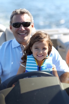 kids learn to navigate a boat